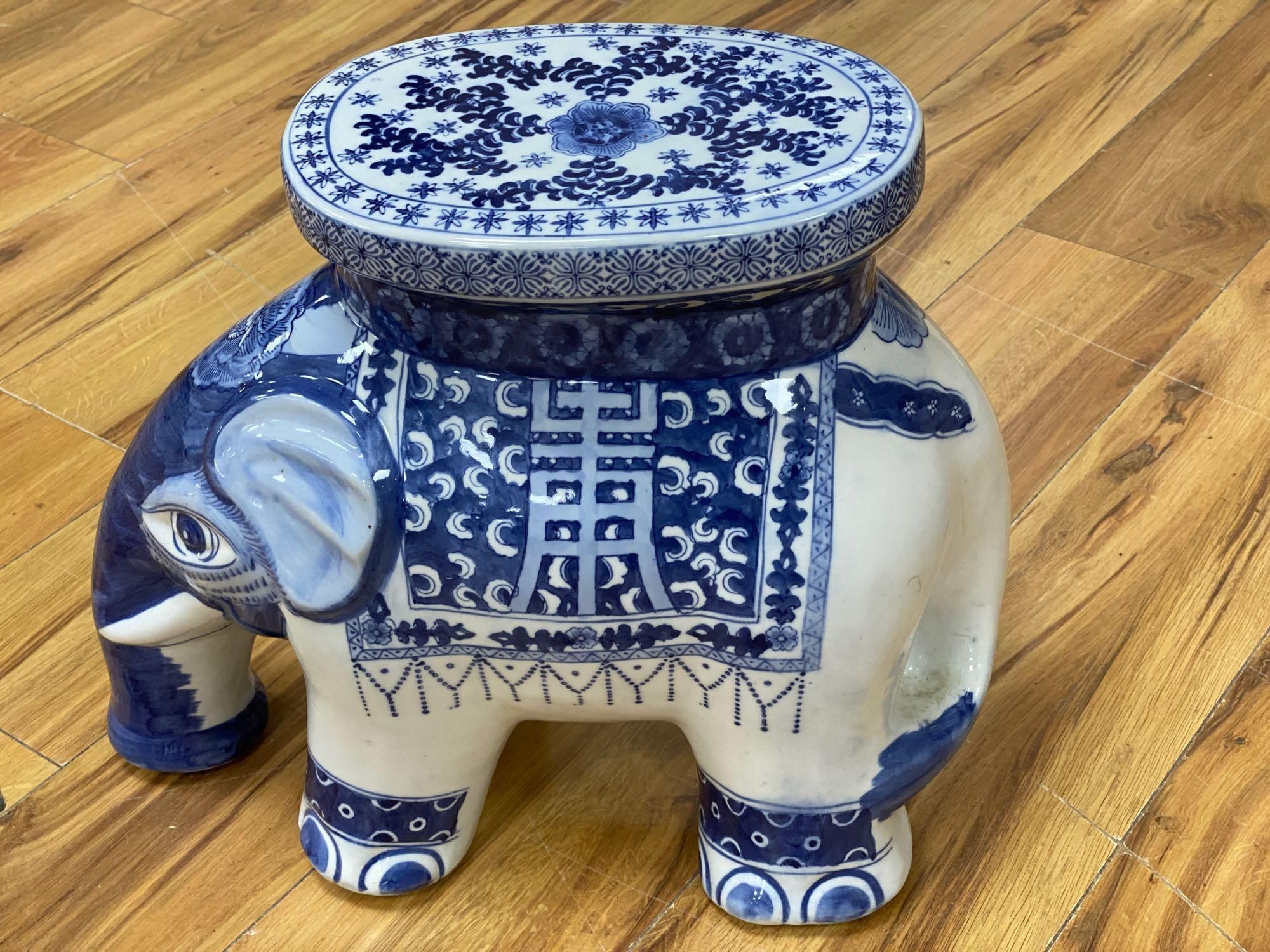 A Chinese blue and white ceramic garden seat and a similar elephant seat, 47.5cm tall